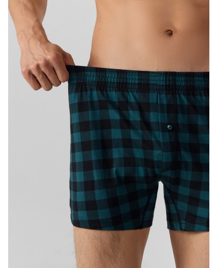 Трусы черная клетка на зеленом